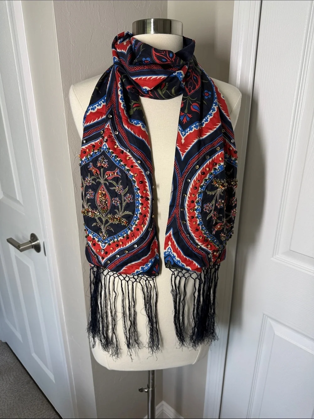 Navy bkue and red print scarf with fringe, beading, and jewel embellishments